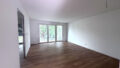 Wohn-/Esszimmer mit Zugang zum Balkon